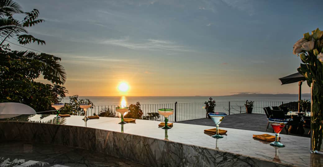 Enjoy sunset drinks at the bar