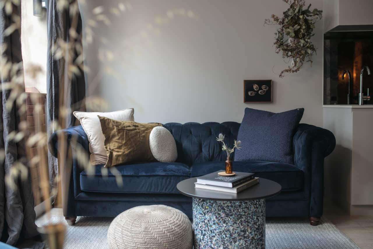 The light flooded lounge room, with velvet chesterfield to cosy up with a good book & glass of wine