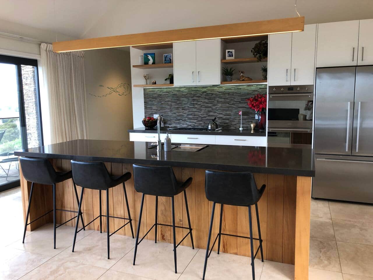 Entertainers kitchen with Smeg double oven and large gas hob (5 burners). Scullery beside the double door fridge/freezer with Italian Rocket coffee machine & grinder, airfryer, etc etc Webers bbq on the back deck. Spare fridge in garage