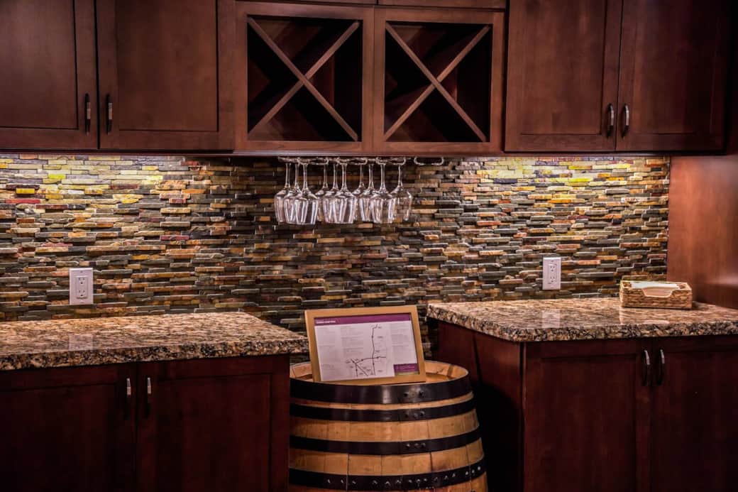 Bring some of your favorite wine to enjoy ain this wonderful space. A dedicated wine bar area boasts a stylish wine barrel. It offers stemmed wine glasses as well as plastic wine cups so you can safely drink around the hot tub.