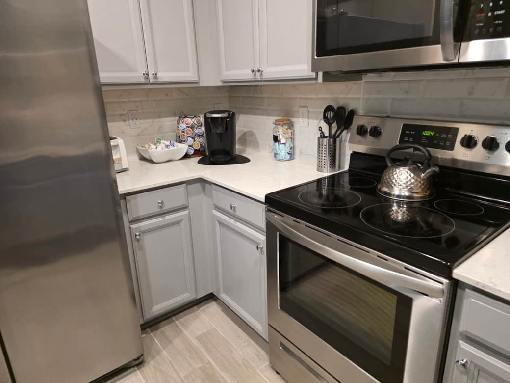 Kitchen features spacious counterspace and cooking utensils