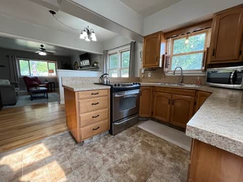 Open kitchen keeps the cook connected to the conversation.