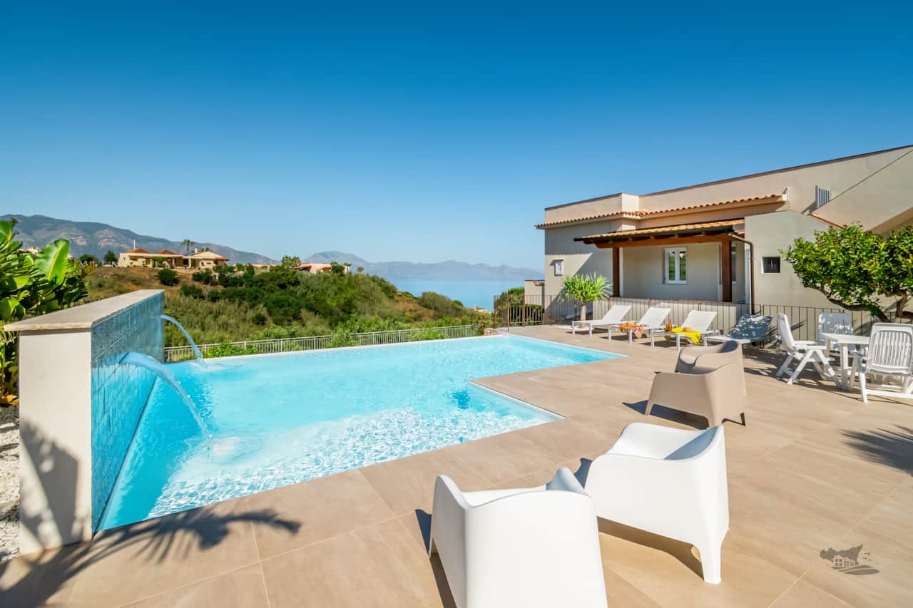 Relax by the stunning infinity pool, surrounded by lush Sicilian greenery and peaceful open spaces.