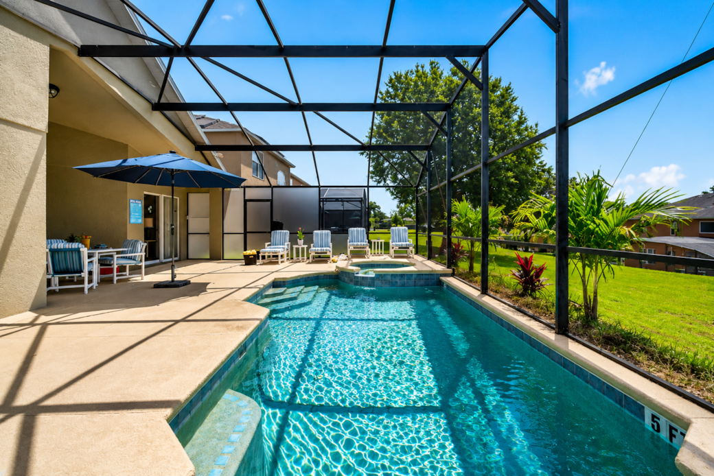 Pool with extra large deck, umbrella, lounges,  table and chairs. Saftey gate that comes down 