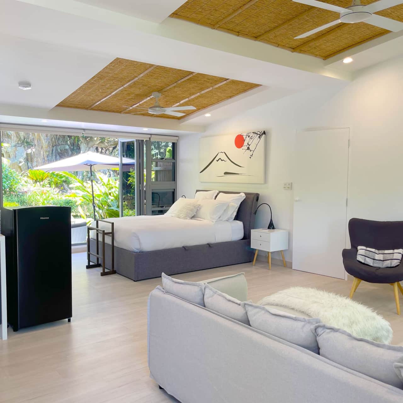 Zen Garden Suite queen bed and coastal décor