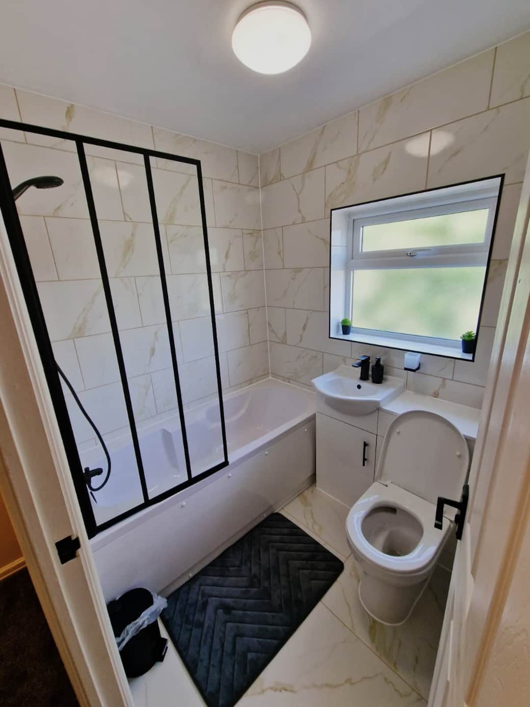 Contemporary bathroom with shower bath