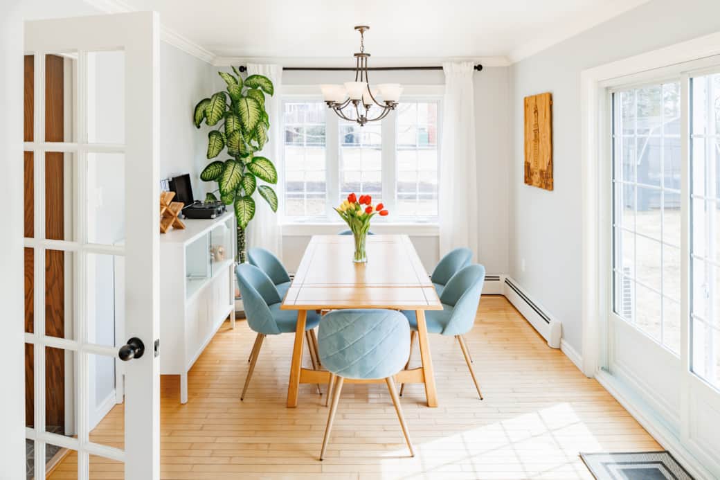 Sunlit dining area with seating for six and a fresh, modern feel.