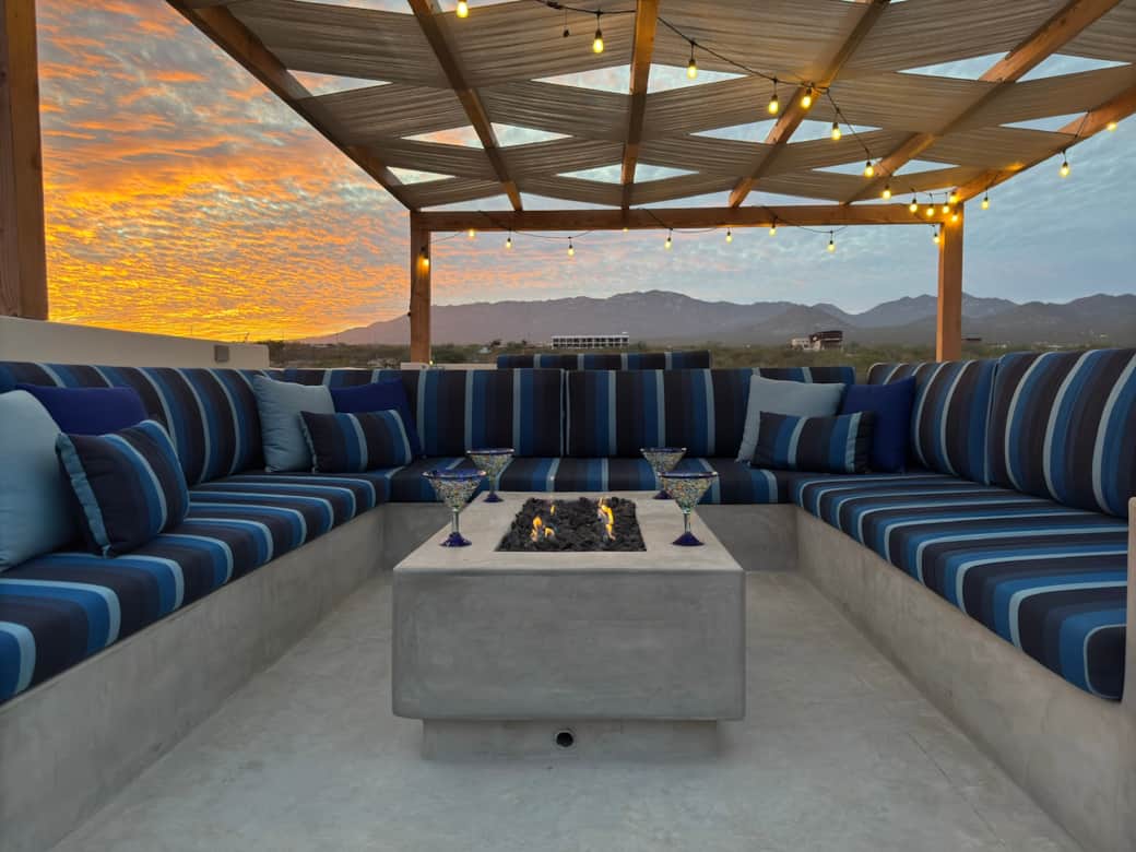 Snuggle up on the rooftop with comfy seating, breathtaking views, and a fire table for cooler nights
