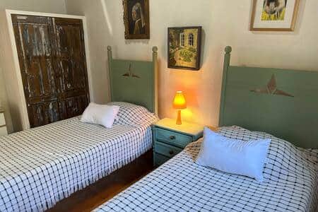 Twin beds with wardrobe and chest of drawers