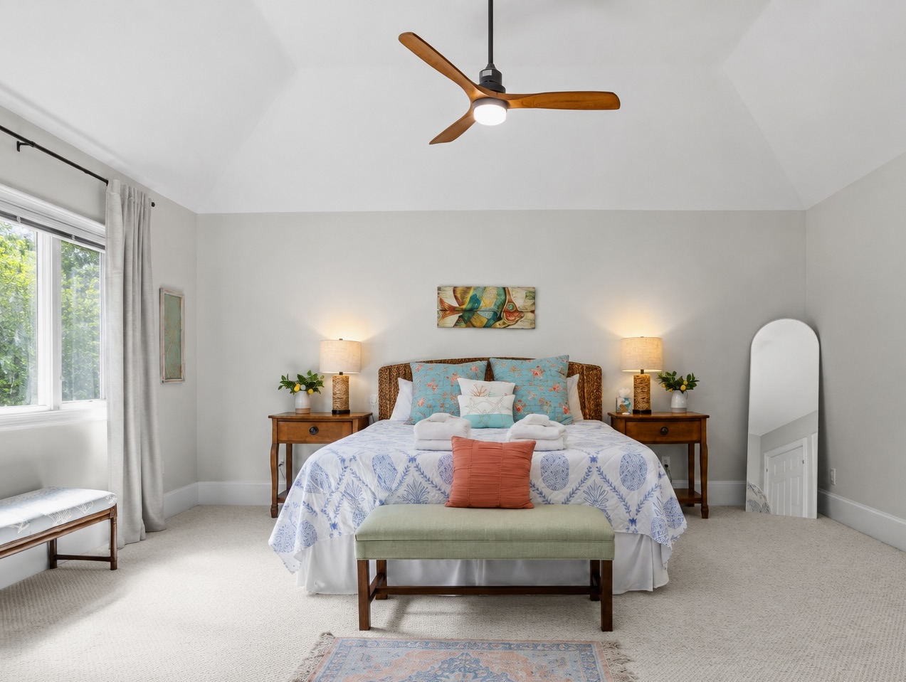 King Bedroom 2 with a window bench and ceiling fan