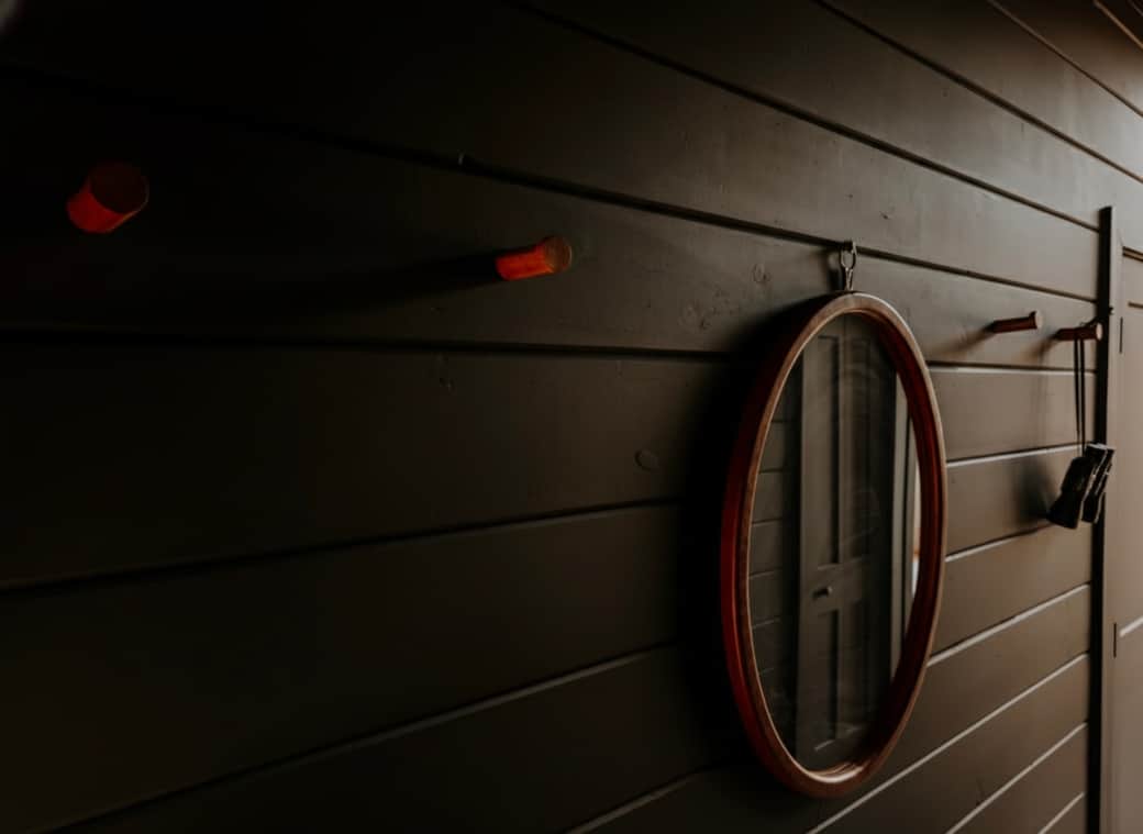 Main level hallway connecting the living room, bedroom, and amenities Main level hallway connecting the living room, bedroom, and amenities