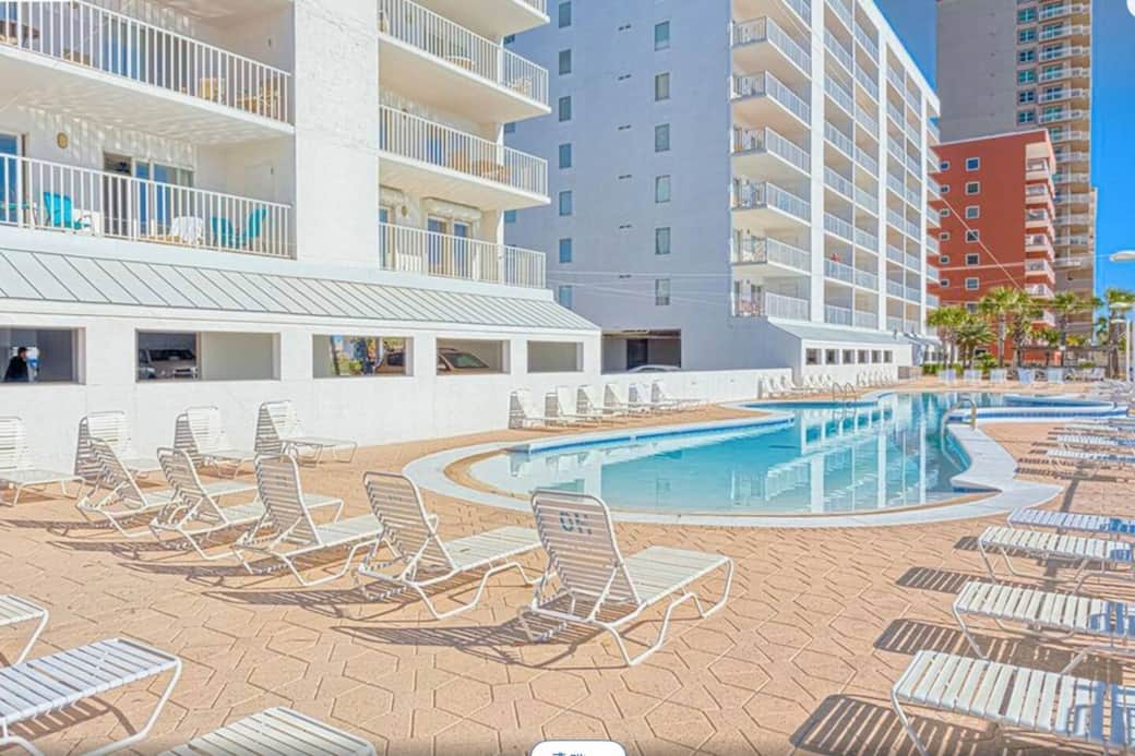 One of the largest pools in Gulf Shores! Walk-in from each side w seating and waterfalls in the middle.