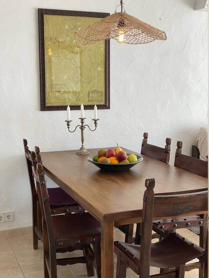 Dining area inside Ibiza Seaview Apartment with wooden table