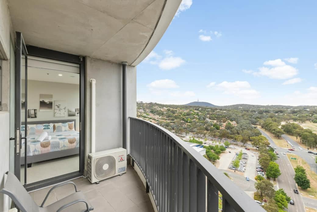 Step outside onto your balcony and be greeted by the majestic mountains in the distance. This vantage point offers a breathtaking panorama of the natural landscape, blending seamlessly with the city below. 