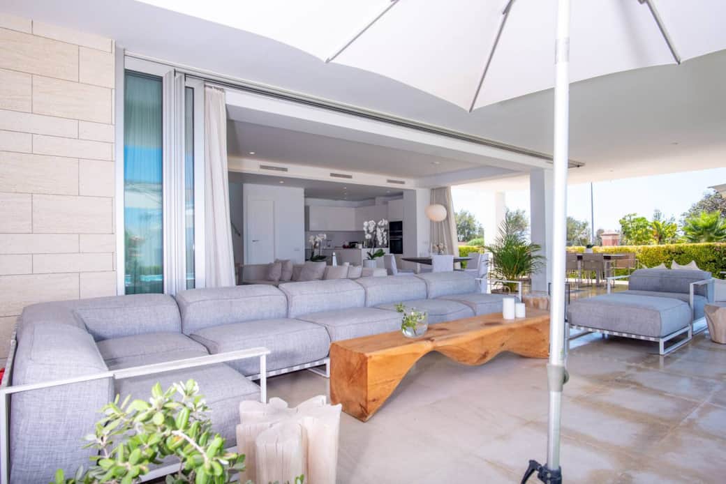 Covered terrace looking directly to pool and gardens Covered terrace looking directly to pool and gardens