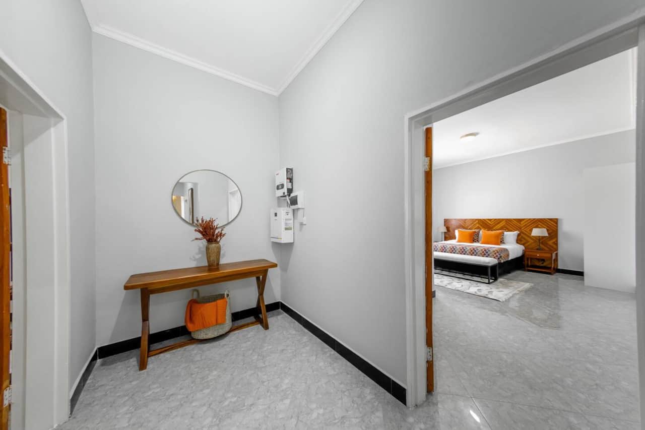 Entrance hallway leading to bedroom and living areas