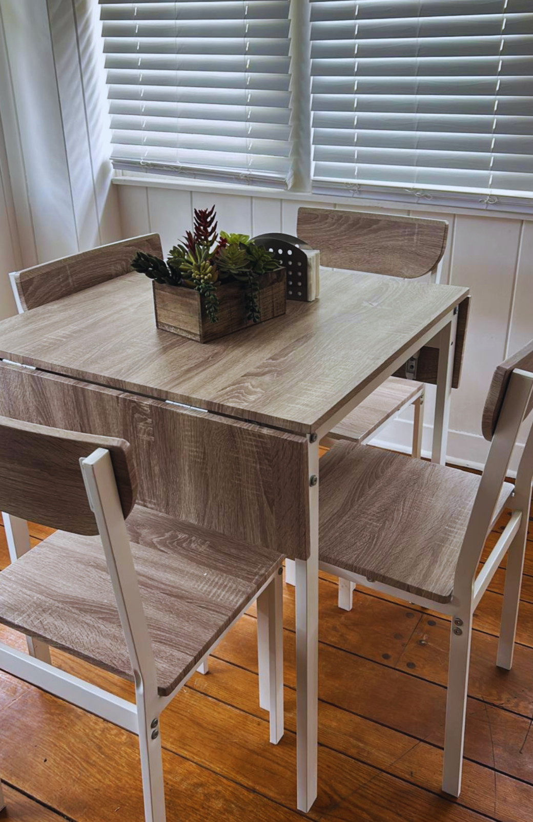 Charming dining table for 4 with stylish centerpiece decor. Lakeland, FL