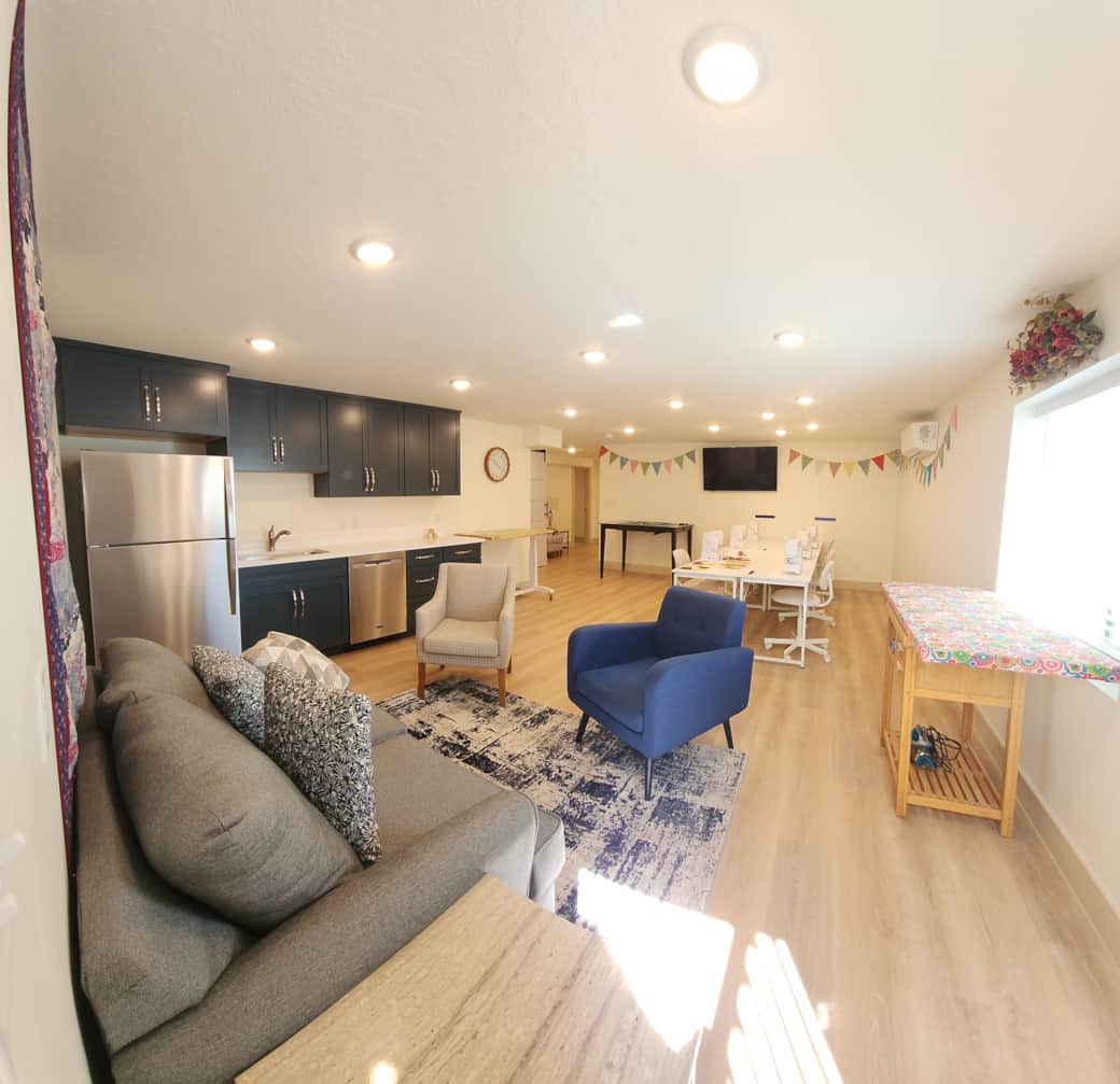 Sewing studio for six has two cutting tables, two ironing stations, and comfortable sewing chairs. Sewing studio for six has two cutting tables, two ironing stations, and comfortable sewing chairs.