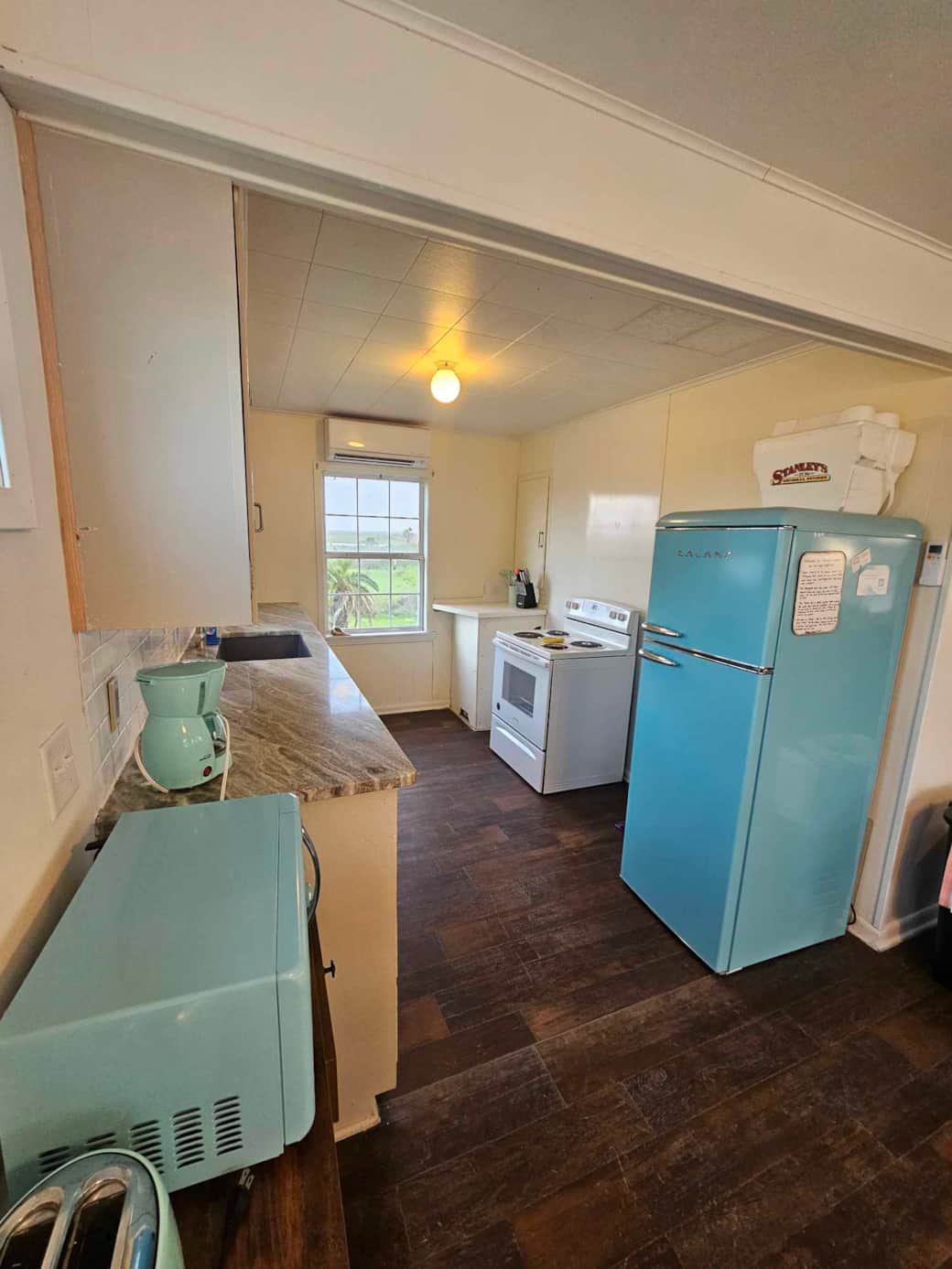 There is a small coffee maker, microwave, crock pot, and other basic appliances There is a small coffee maker, microwave, crock pot, and other basic appliances