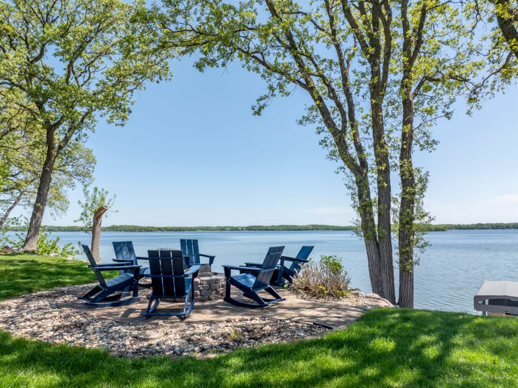Firepit with rocking chairs and lake views