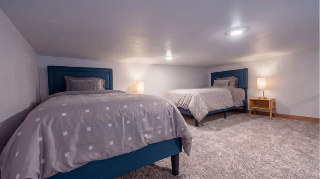 Airy view of the loft sleeping area which overlooks the main level in the Black Hills, SD.