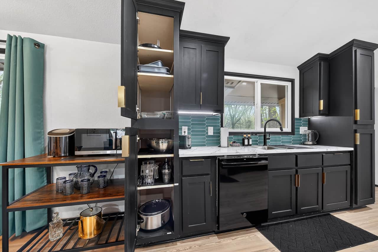 Bright kitchen with modern appliances, generous counter space, and a convenient coffee bar.