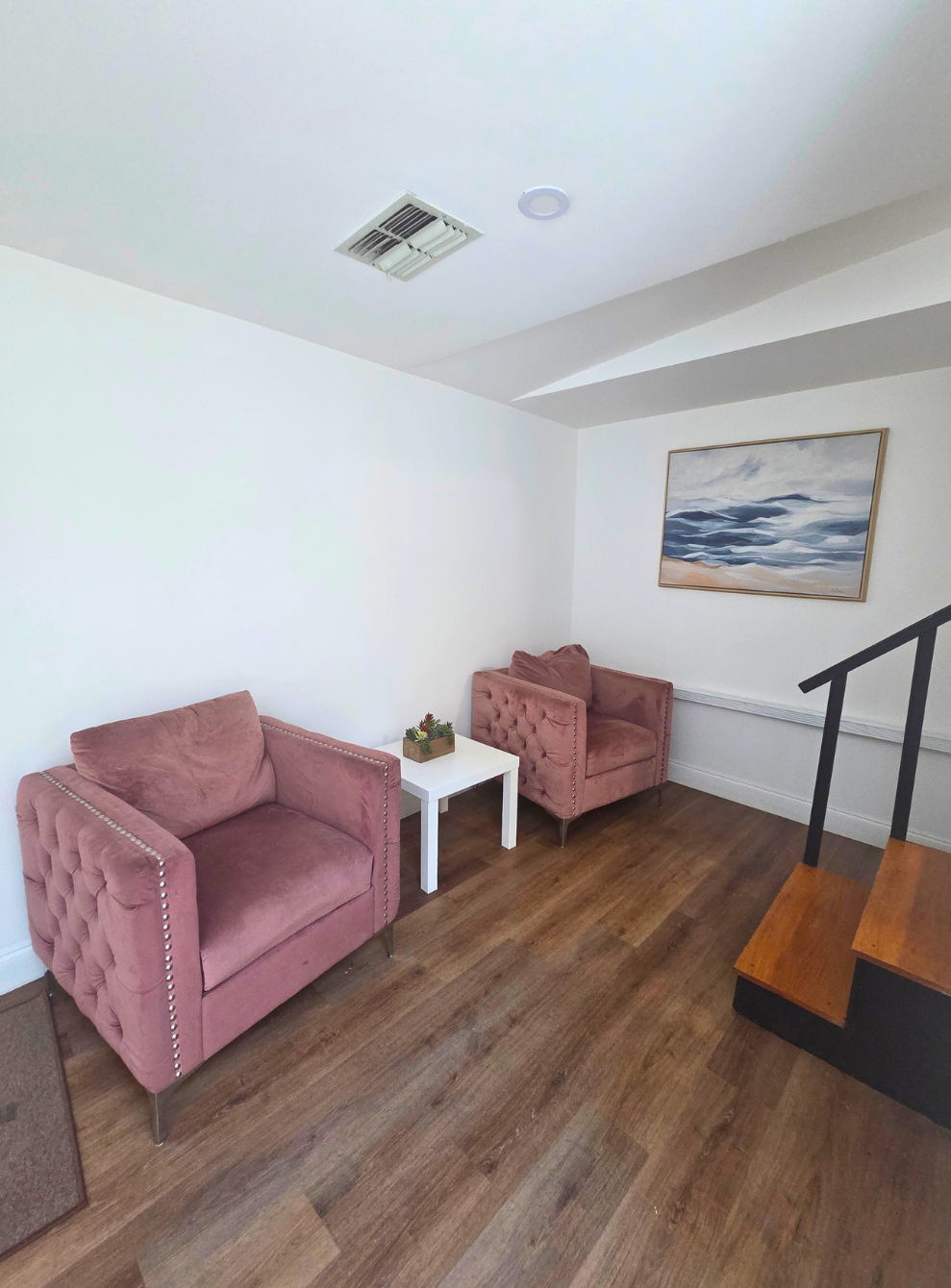 Two inviting armchairs and a coffee table create the perfect relaxation spot. Lakeland, FL