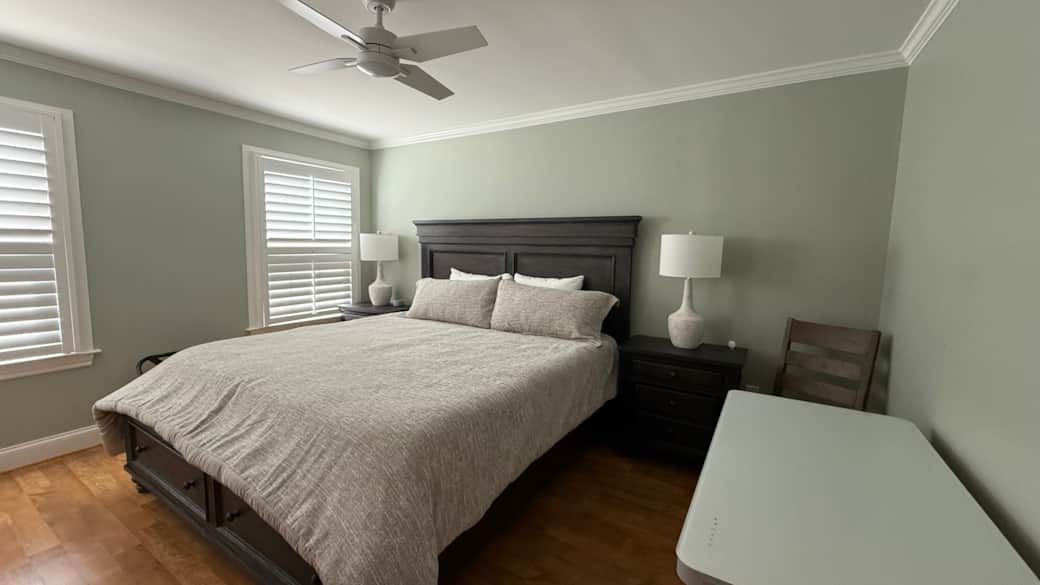 Main Level King bedroom with TV and power adjustable height desk