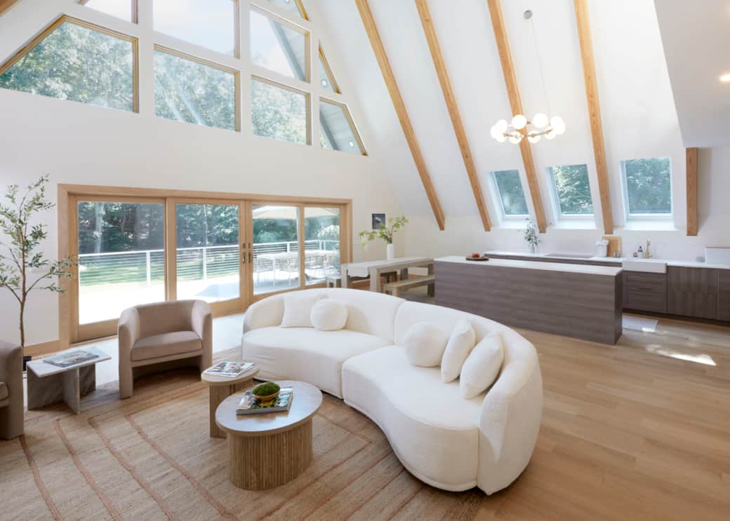 The Great Room with 30ft vaulted beams and soaring floor-to-ceiling windows