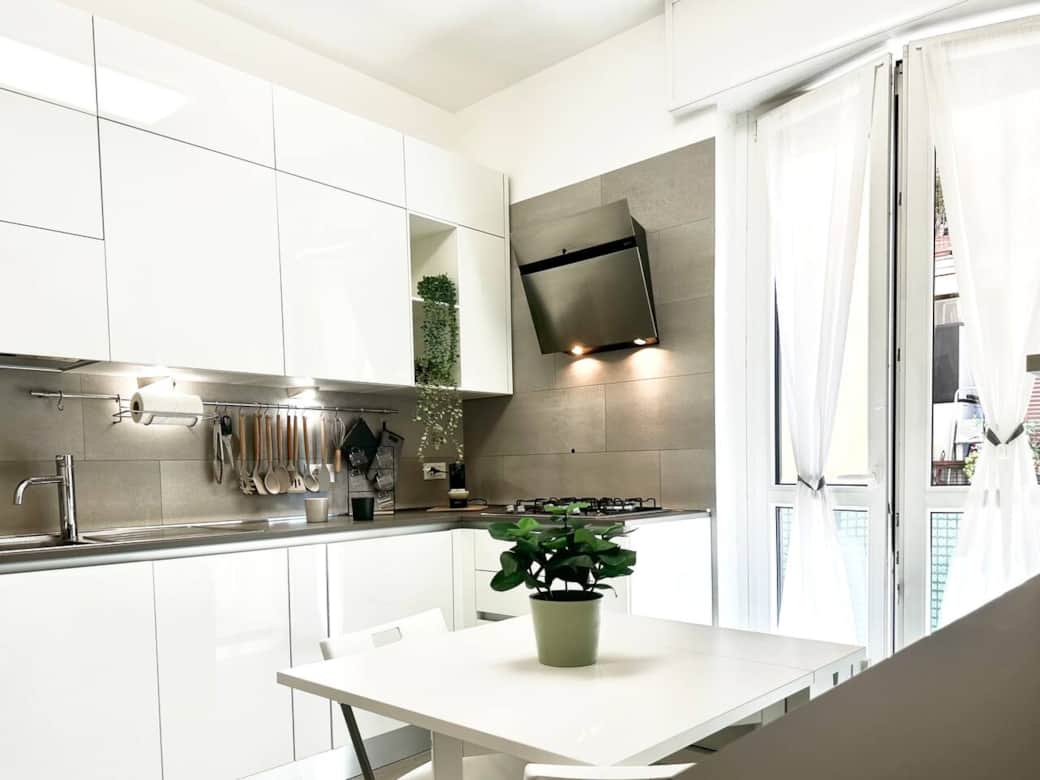 Open space kitchen connected with the living room and entrance. Sofa bed in this area.