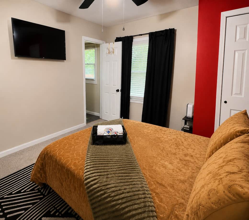 Escape into this beautifully travel inspired room with full size bed, private TV, and bathroom