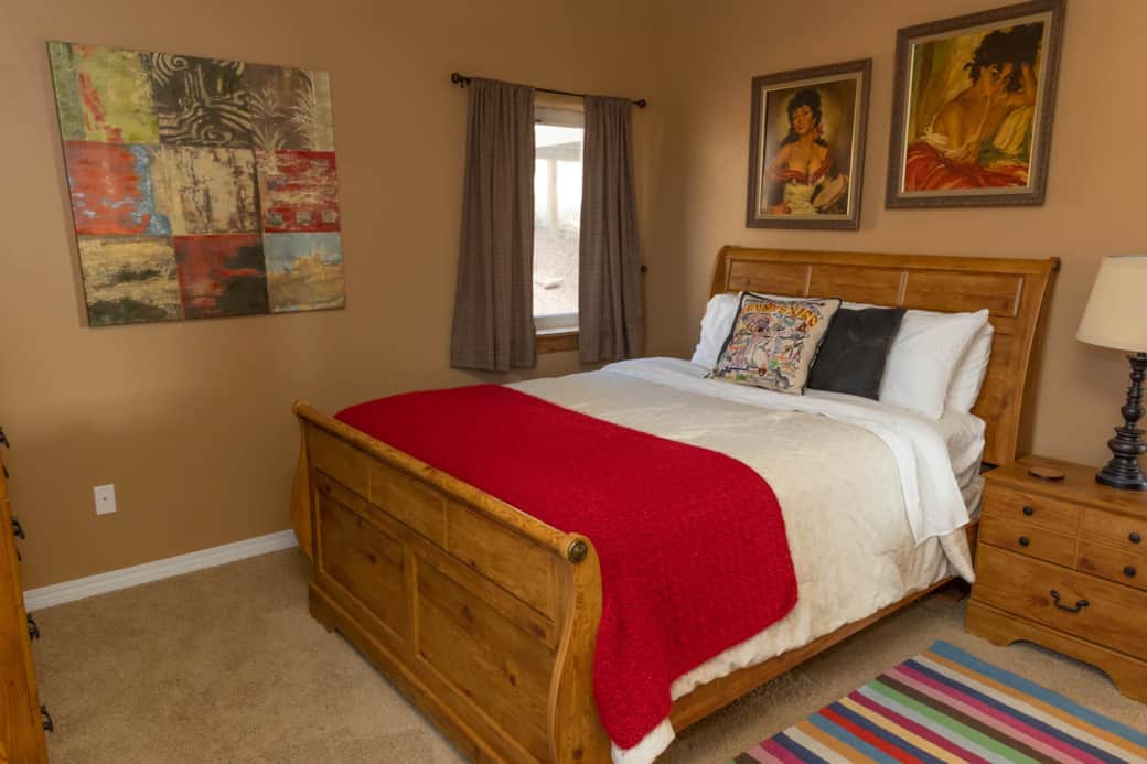 Bedroom 2 has a queen sized bed.