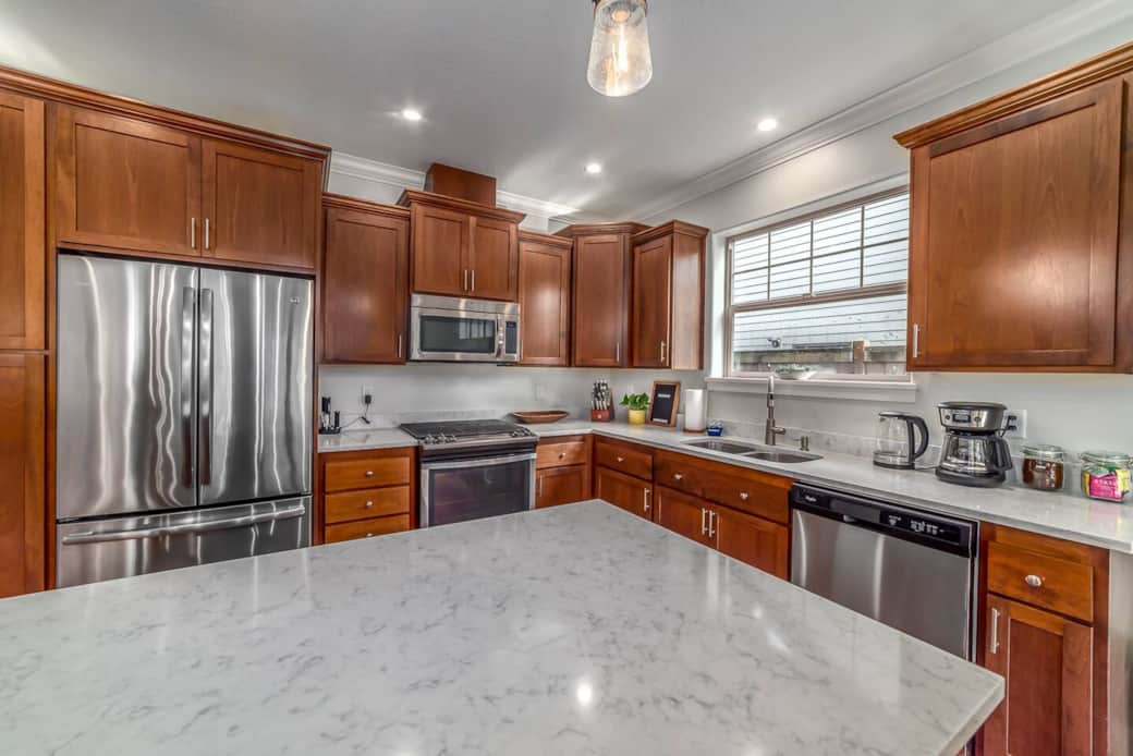 Well stocked kitchen, open to living and dining areas