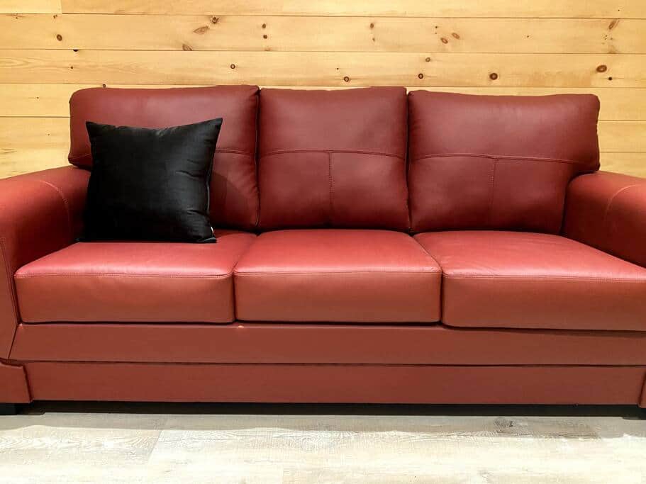 Get comfortable on the red leather sofa and enjoy the views through the large, front windows. 