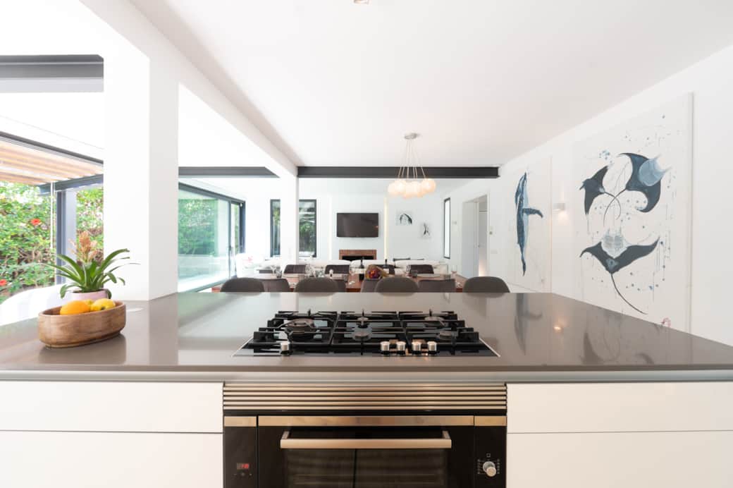 Close-up of modern kitchen island and cooking area at Casa Guindilla in Portals Nous, Mallorca