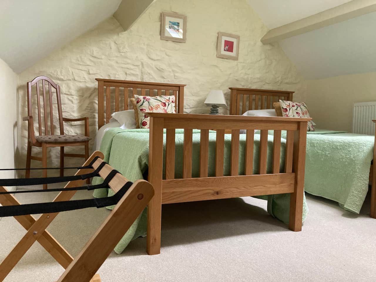 Spacious character attic bedroom with twin beds