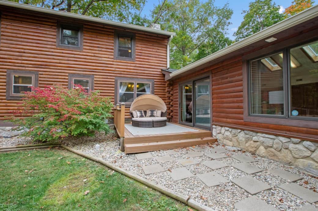 Charming private deck with cozy outdoor seating, perfect for relaxing just steps from the main living space.