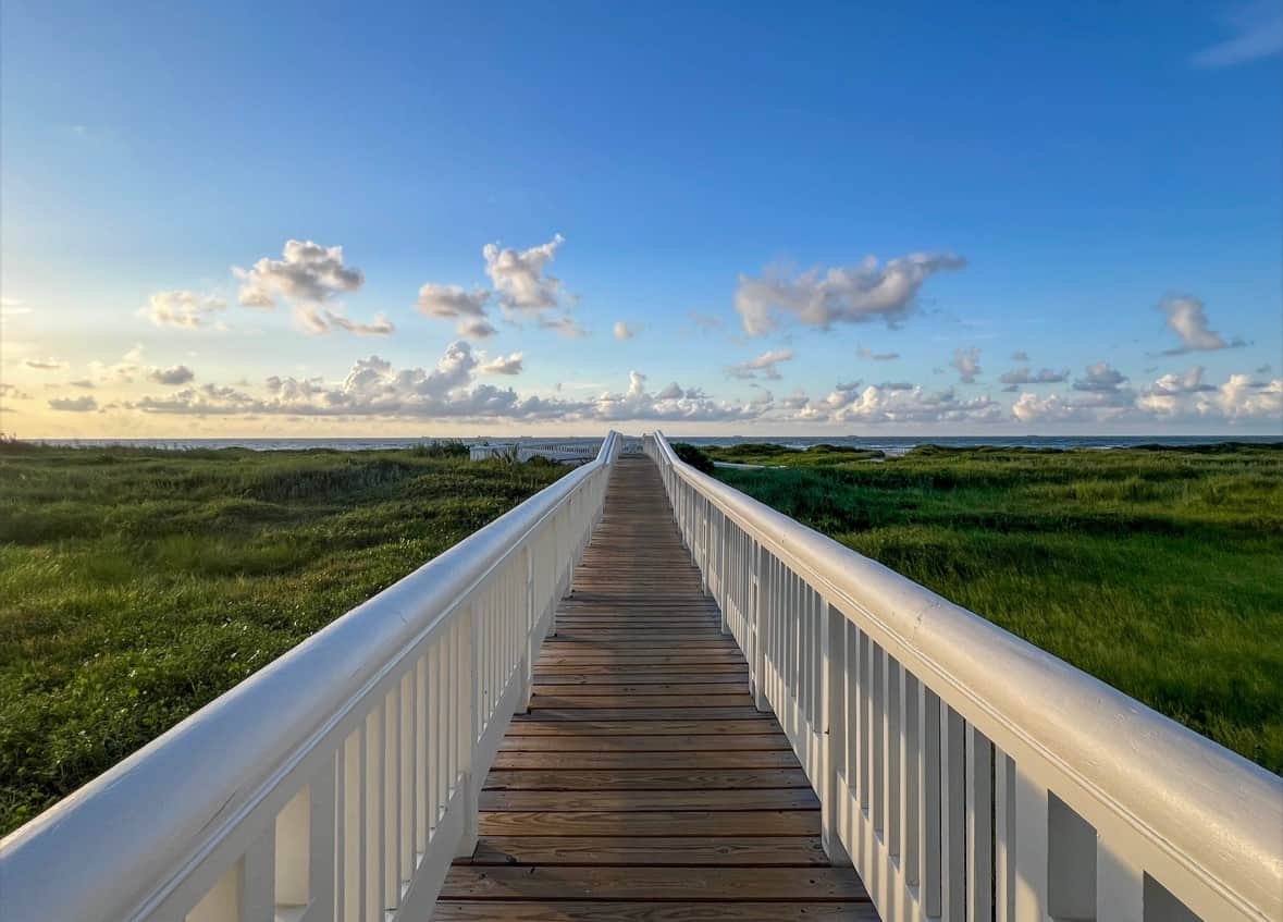 East Beach Galveston during Spring Break with groups enjoying wide open shoreline and Gulf Coast views