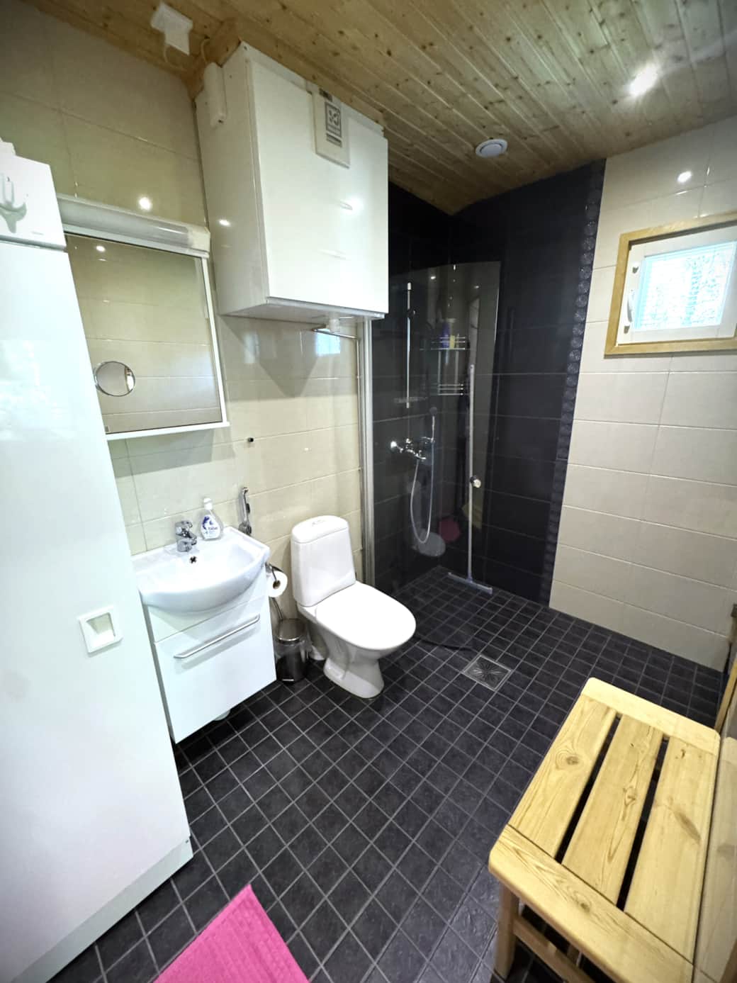The bathroom is spacious, featuring a drying cabinet, a shower cubicle, and a sauna The bathroom is spacious, featuring a drying cabinet, a shower cubicle, and a sauna