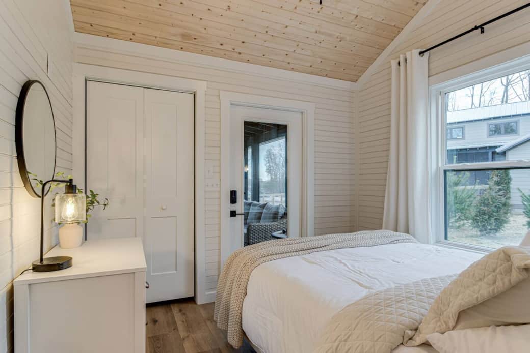 Primary Suite that leads out to screened in porch 