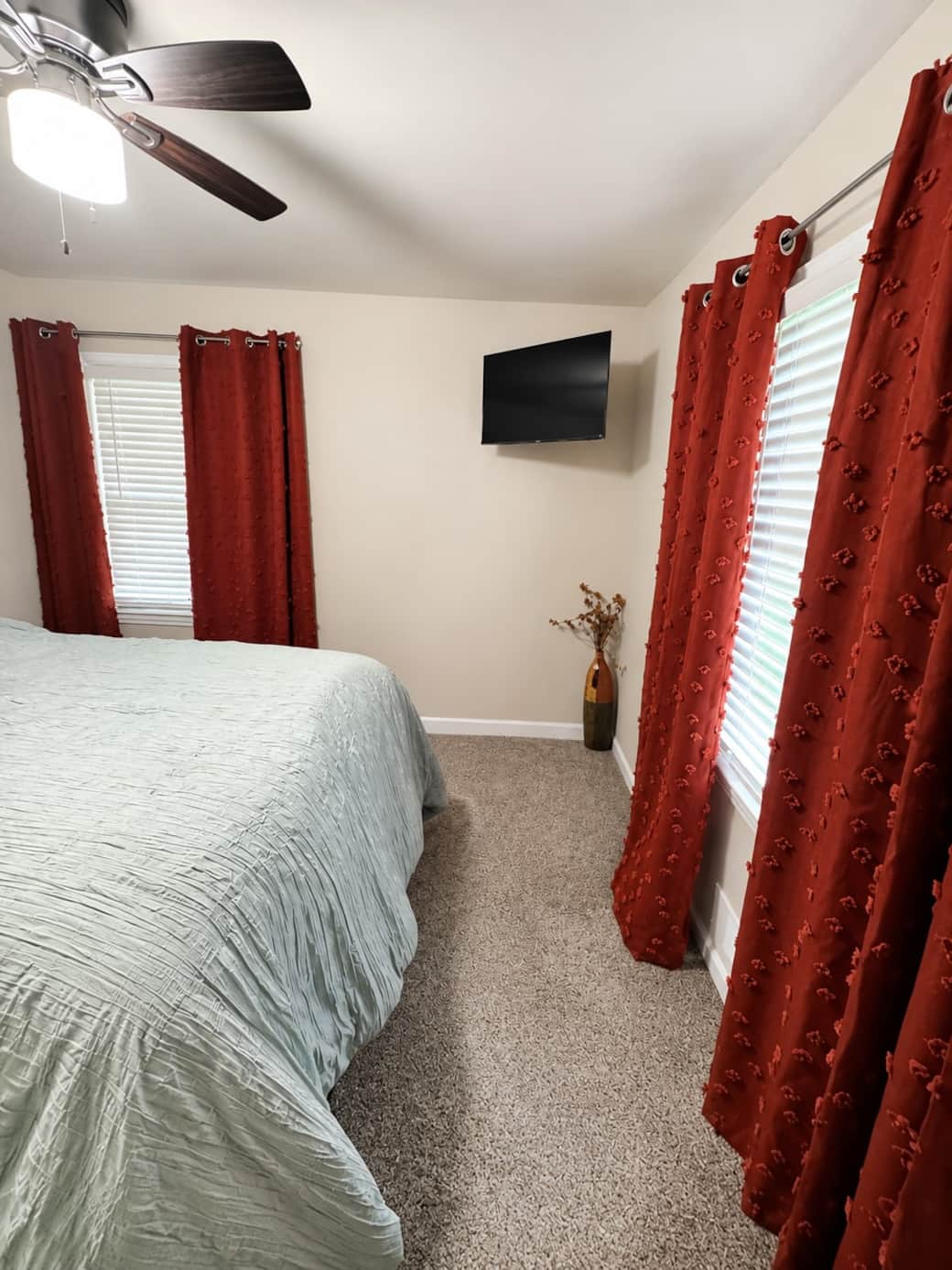 Enjoy this queen size bed, private TV, blackout curtains, and wall decor to help your relax daily.