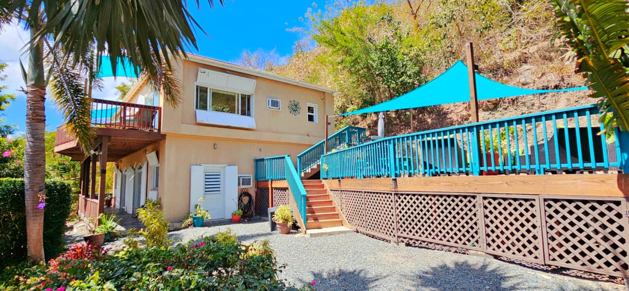 Exterior of home (primary bedroom & living area upstairs | Bedrooms 2 & # lower level)