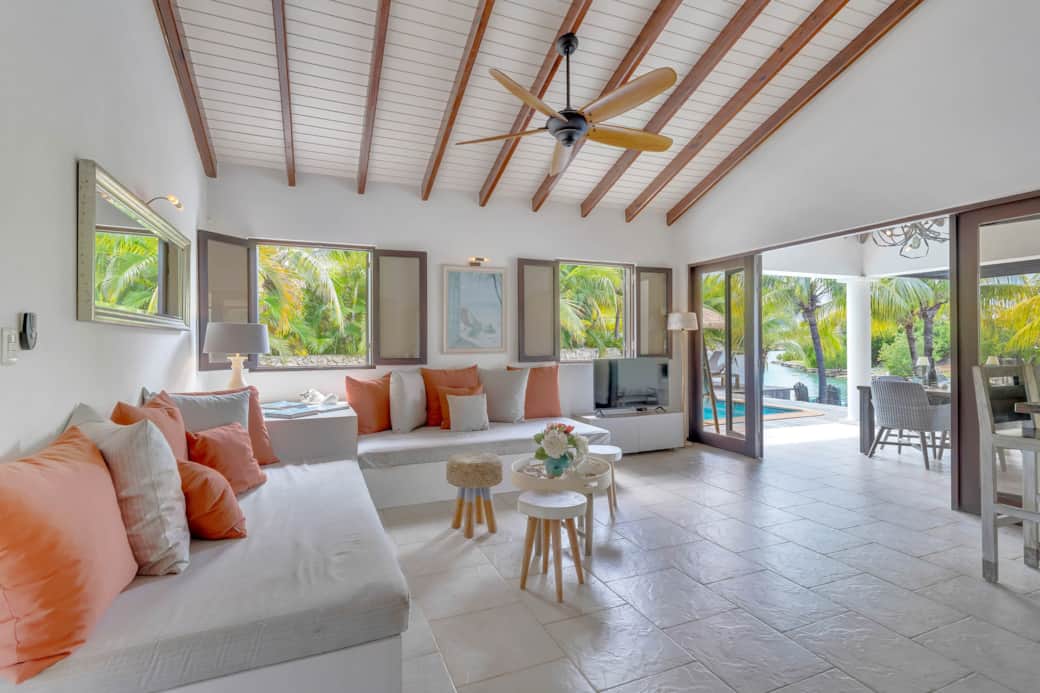 Beachhouse Laguna vacation rental living room with open windows and ceiling fan