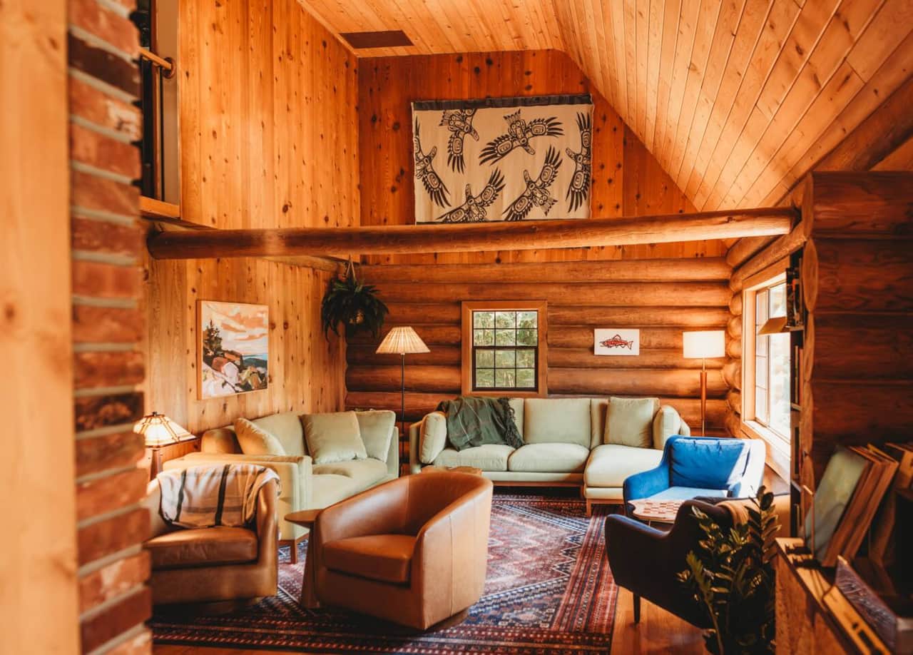 This cozy lodge living room has plenty of seats and activities for all, whether you’re playing chess by the fire or enjoying a heartfelt conversation.