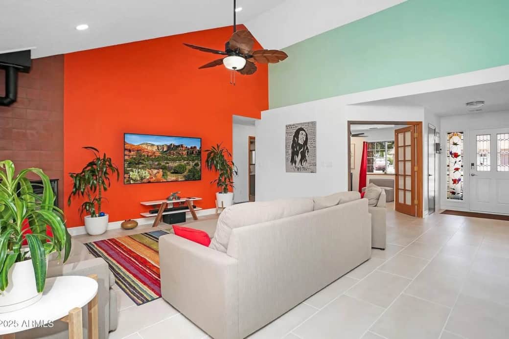 Bright and inviting living space with natural light and open layout connecting to dining and kitchen areas