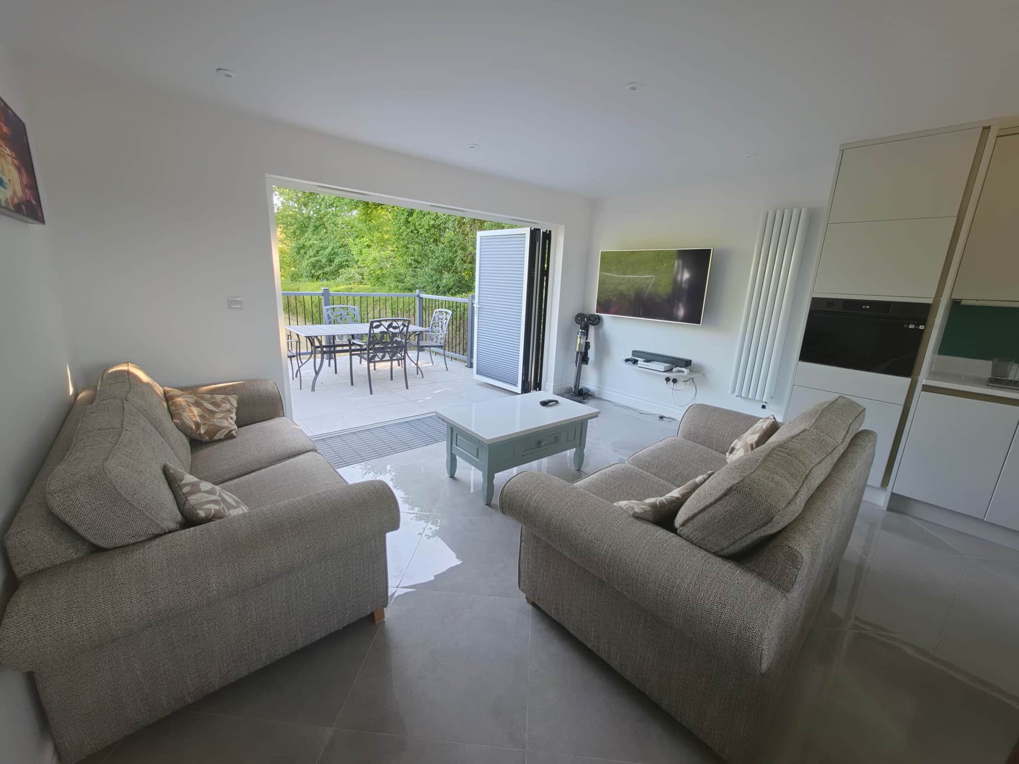 Seating area with bi-fold doors leading to private patio.jpg