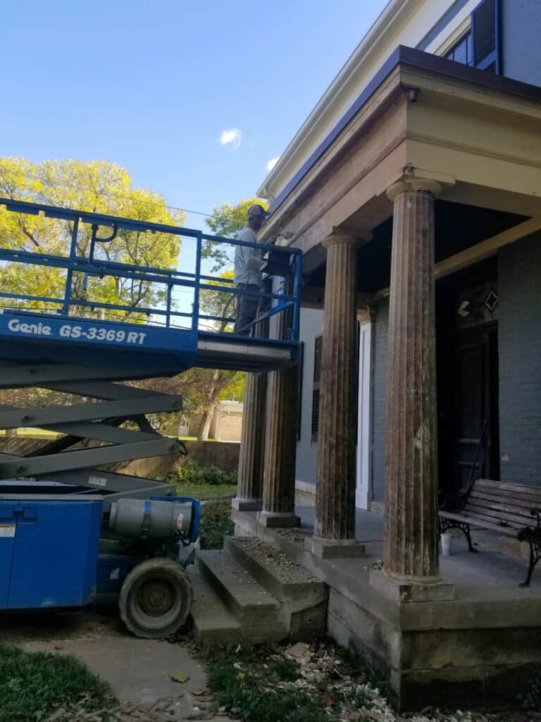 Stripping years of paint off the front portico