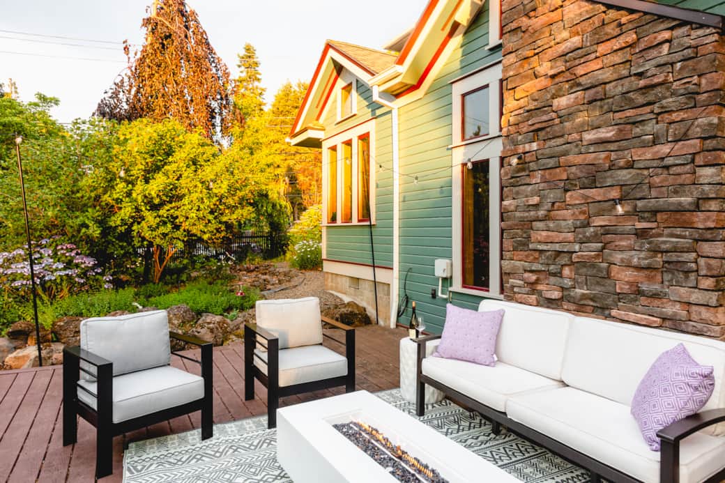 Back Porch with string lights, comfortable seating and fire pit