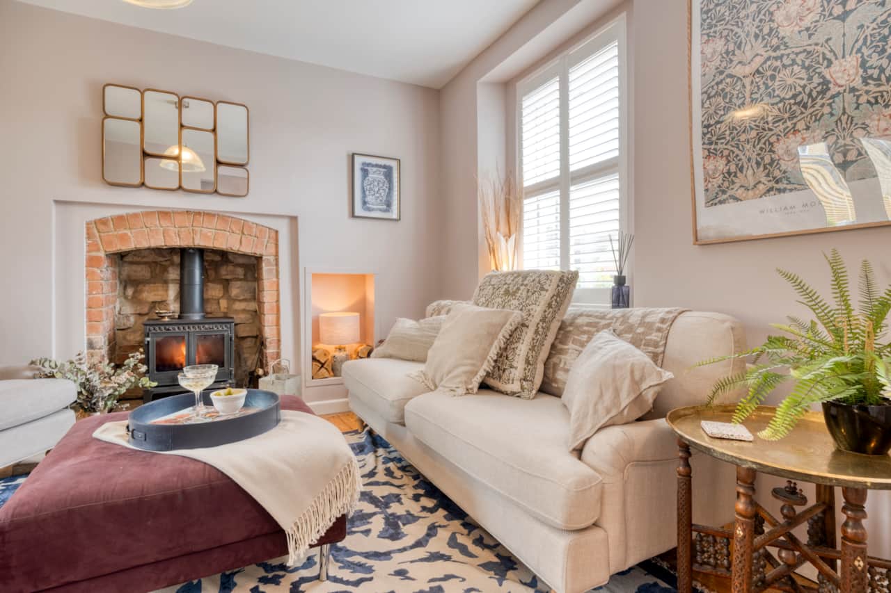 Cosy Cotswolds living room with wood-burning stove