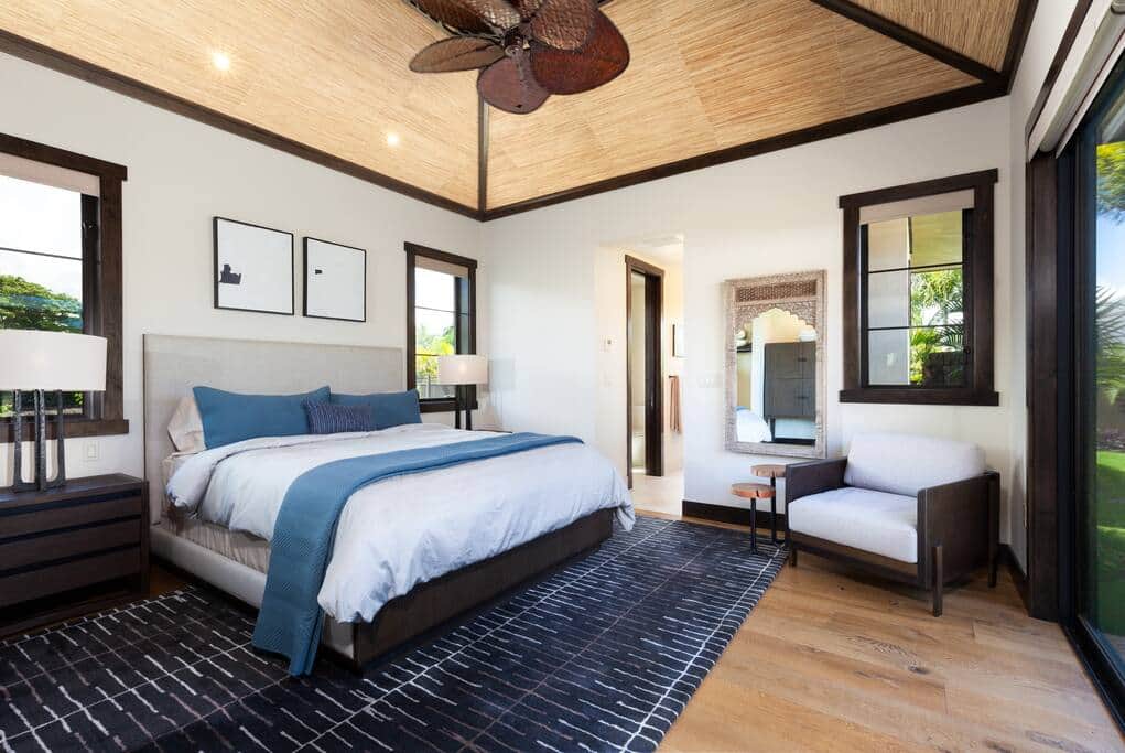 A King-sized bed fills the centre of this master suite.